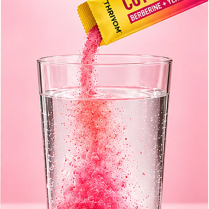 The powder pouring from the stick into a glass of cold water.