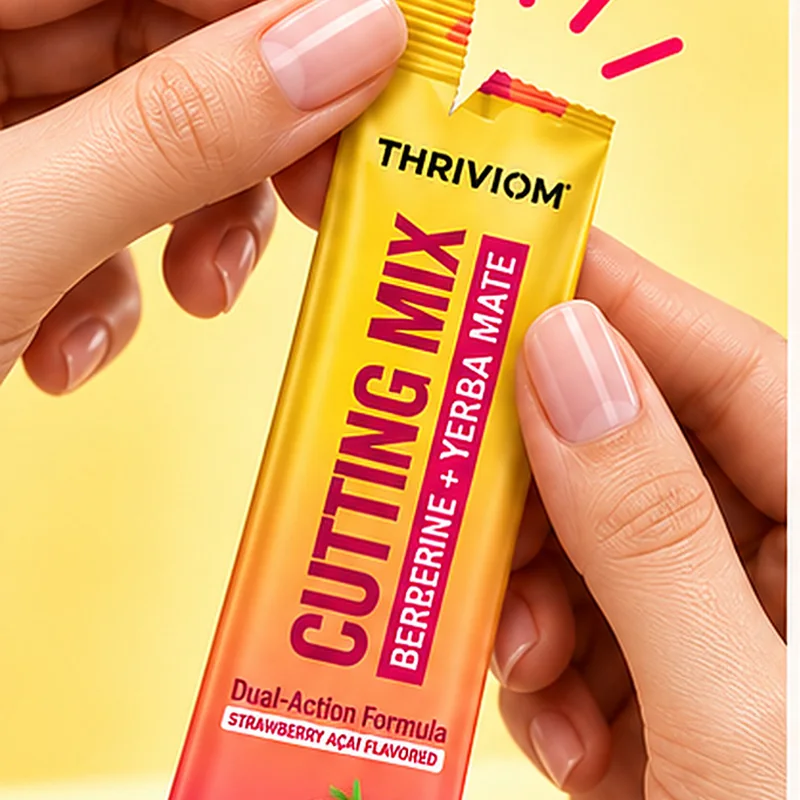 A hand tearing open a Cutting Mix stick pack.