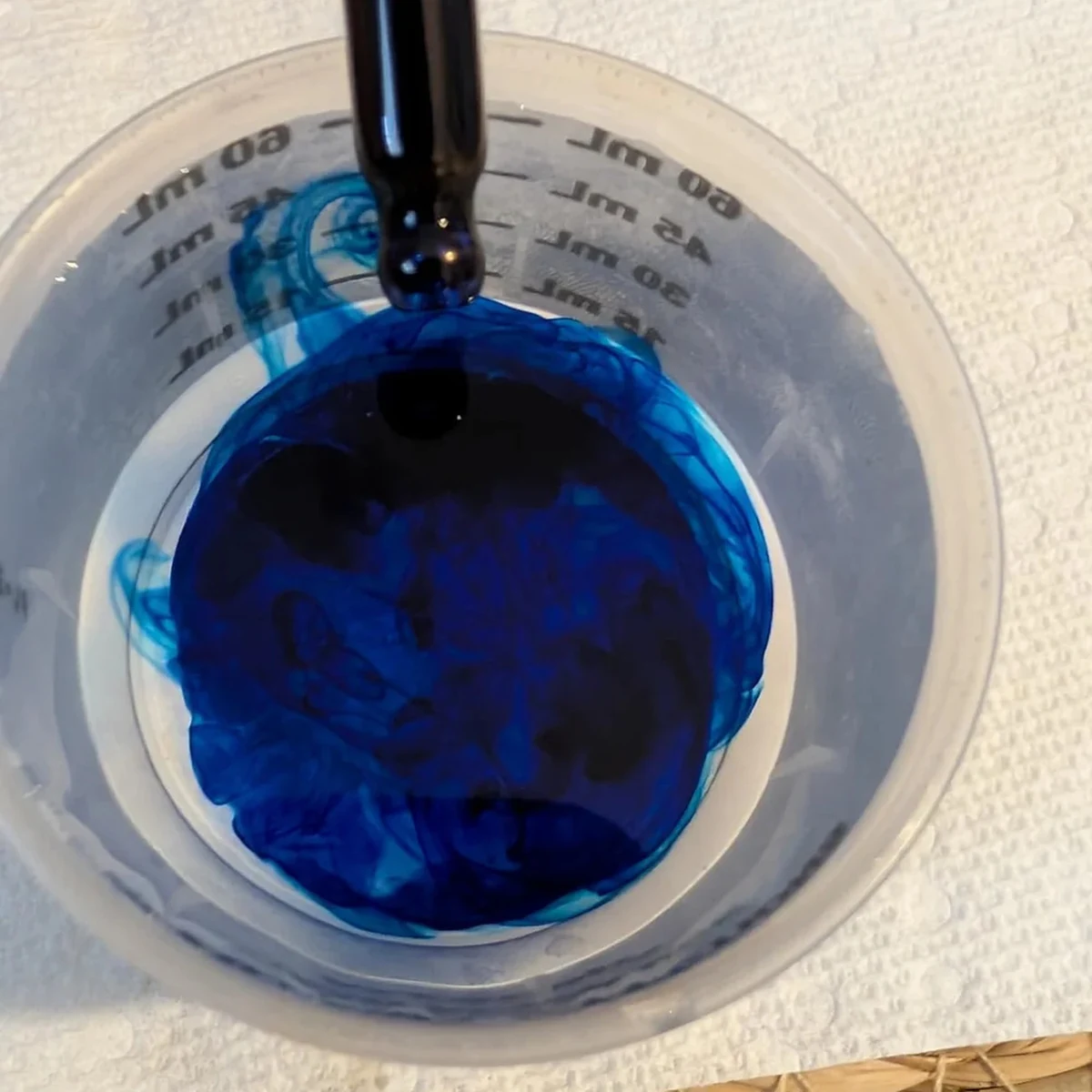 The dropper in use, measuring a single 1 ml serving.