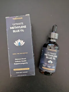 Thriviom Ultimate Methylene Blue 1% box and bottle side by side on a dark countertop